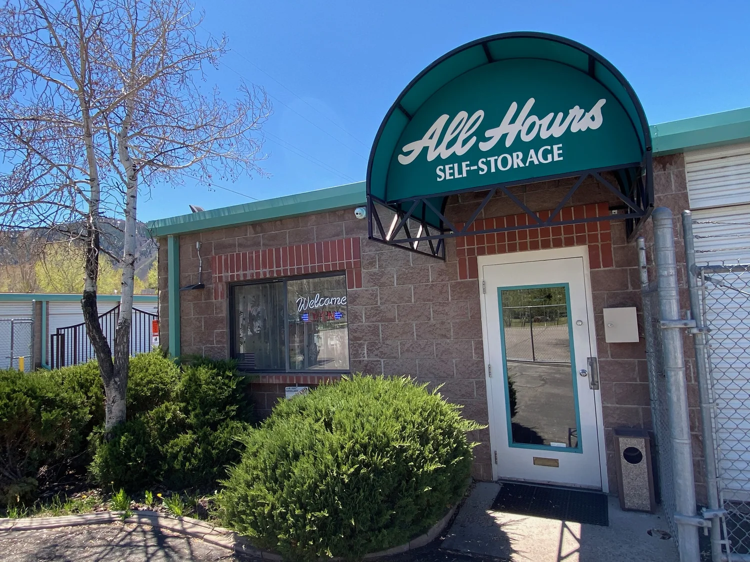 All Hours Self Storage office entrance with its green All Hours awning in Basalt, Colorado